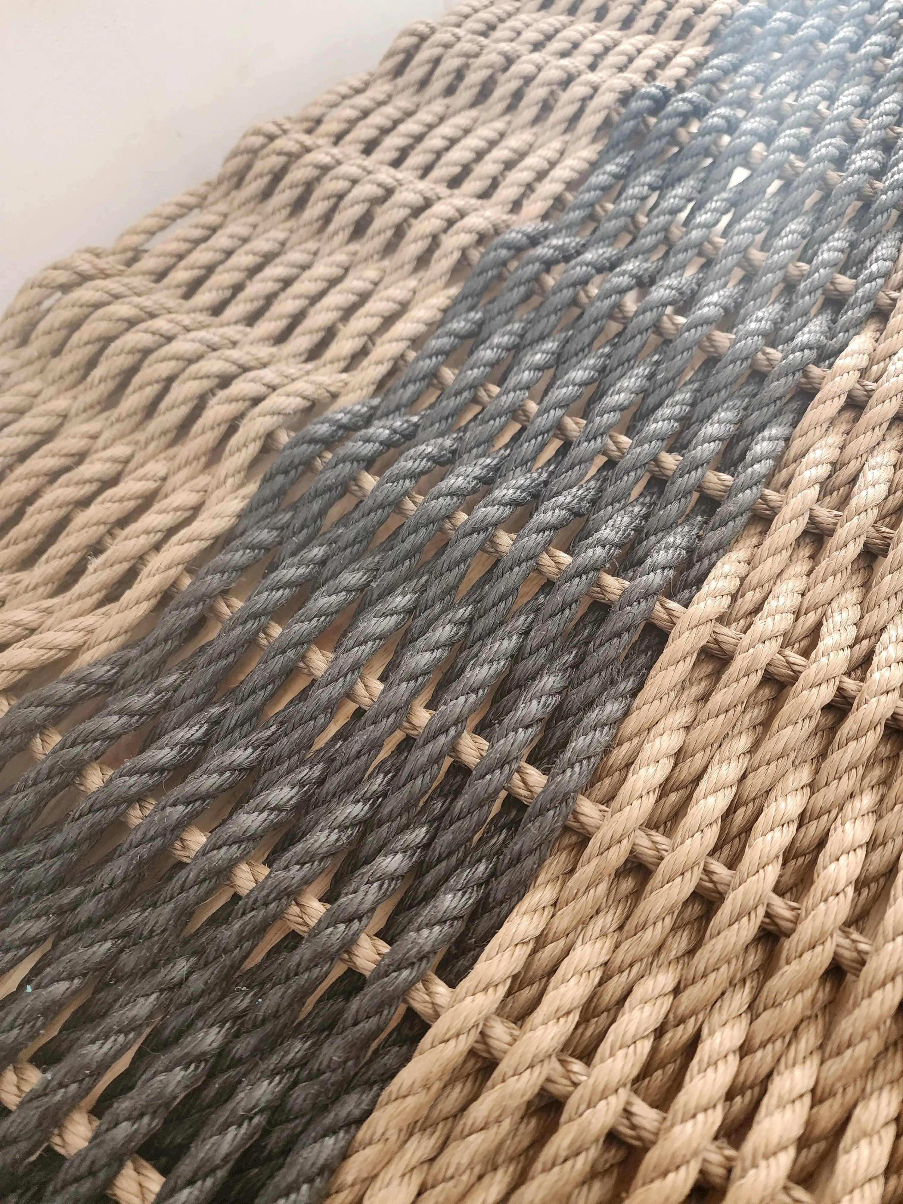 Brown and black rope doormat