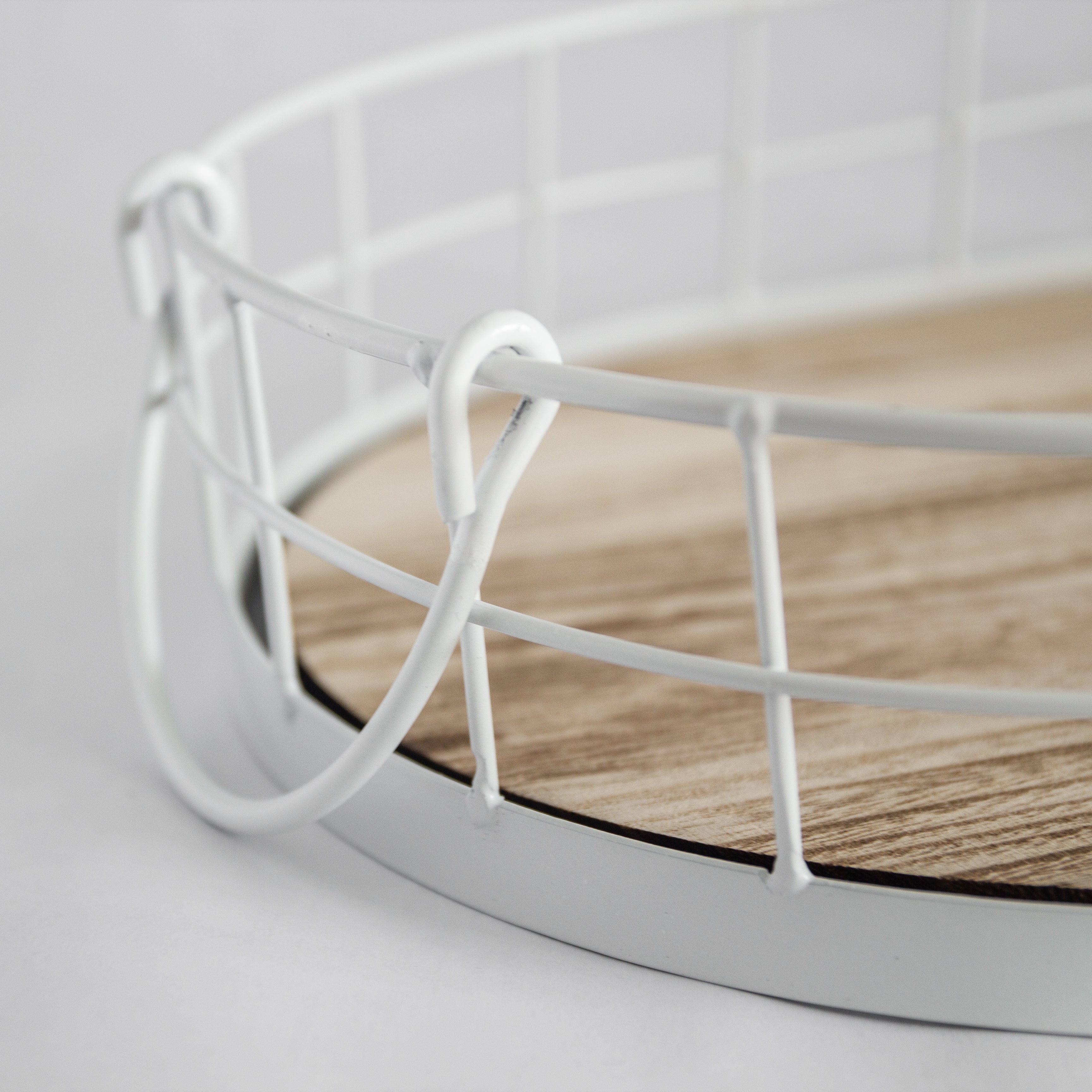 Oval metal and wood decorative tray close-up