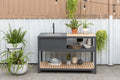Amber aluminum and teak outdoor kitchen with sink