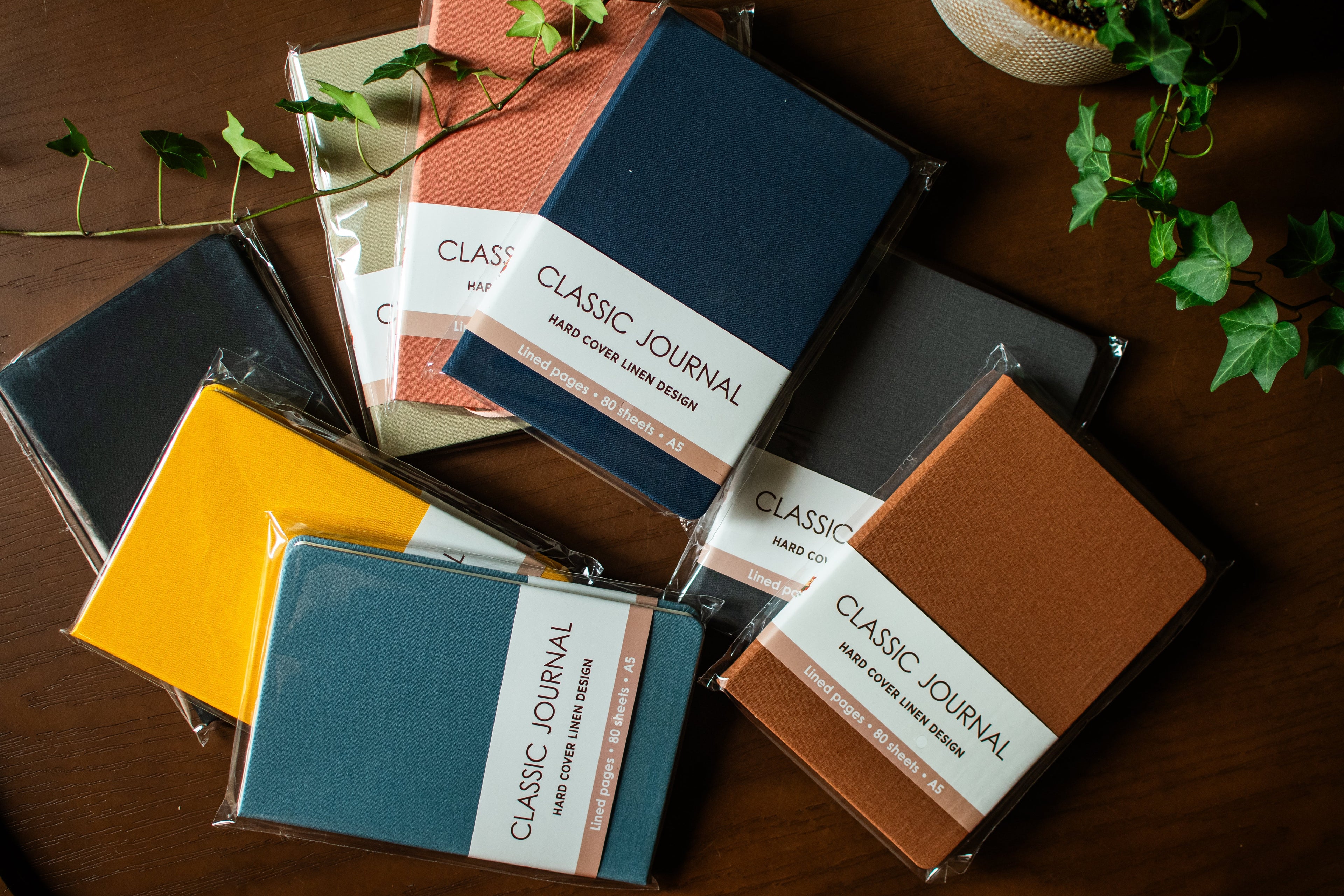 Colorful linen journal set with eight A5 journals