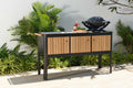 Portals dark outdoor kitchen with sink and cutting board