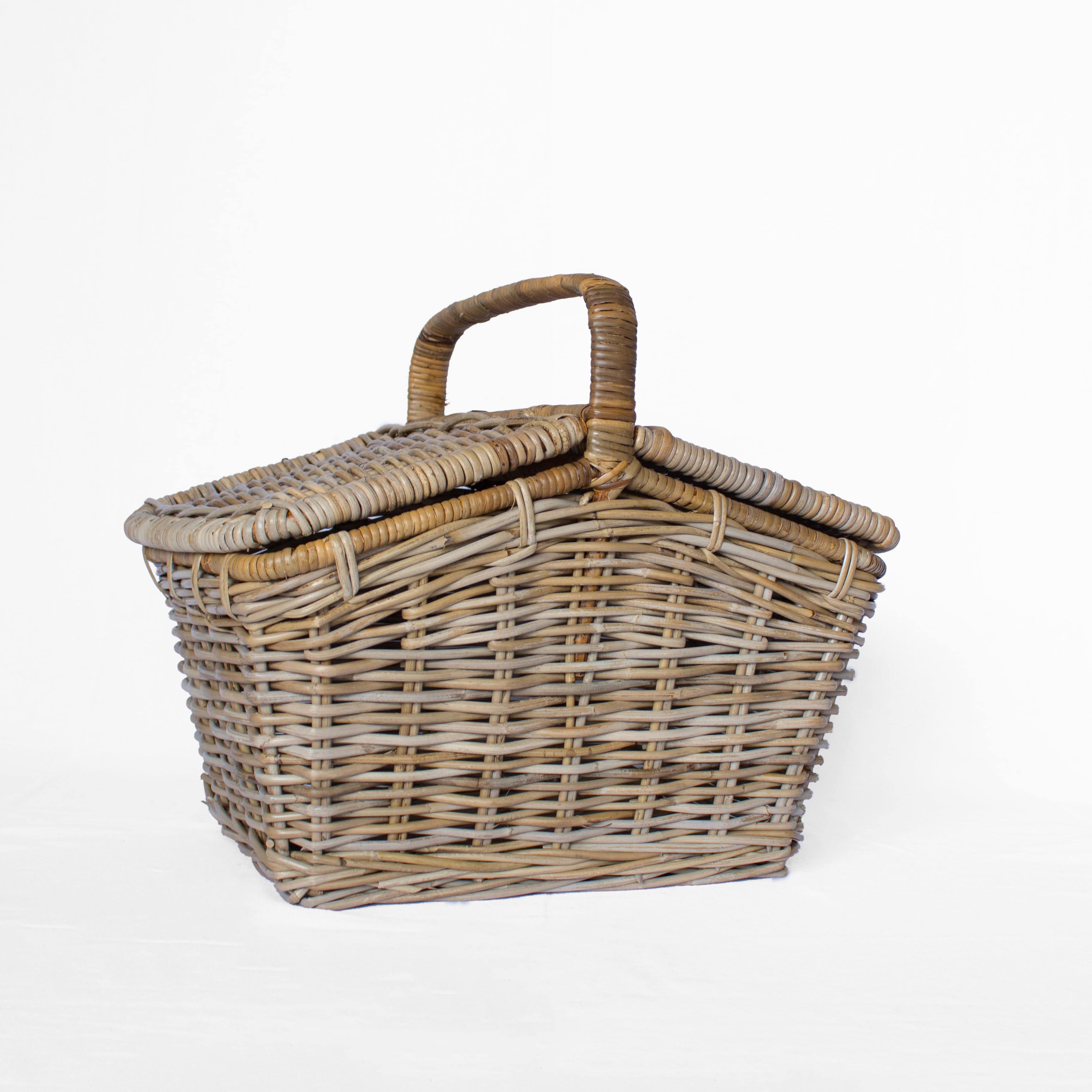 Handwoven rattan picnic basket with carry handles