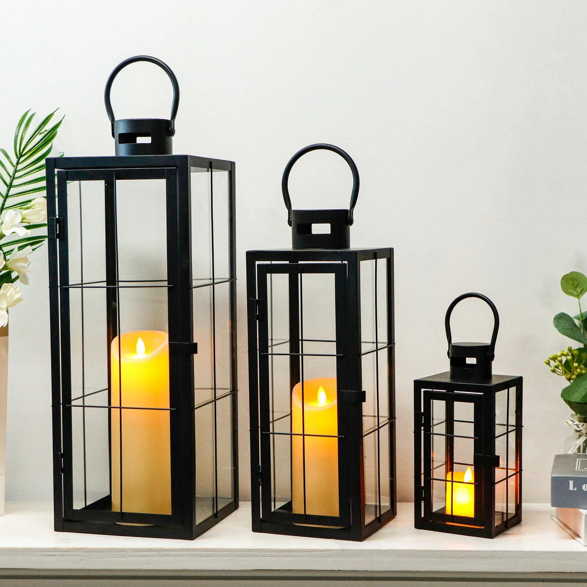 Set of three black metal and tempered glass decorative lanterns by JHY Design