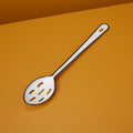 Hani white enamel slotted serving spoon