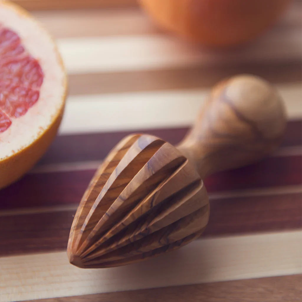 Handcrafted olive wood citrus press