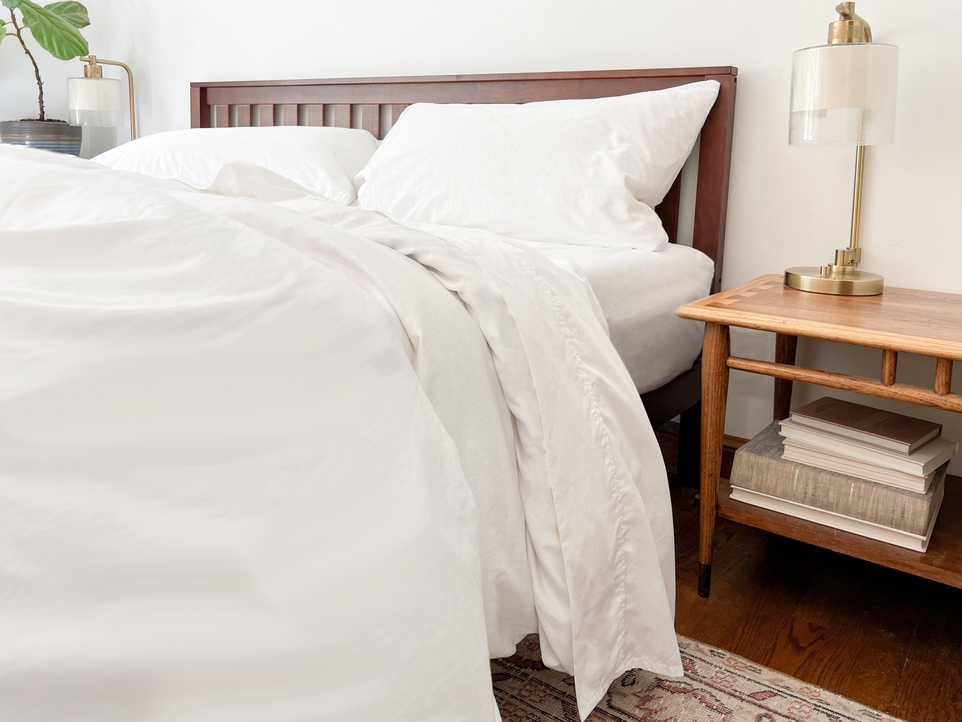 White organic cotton percale sheet set on a made bed
