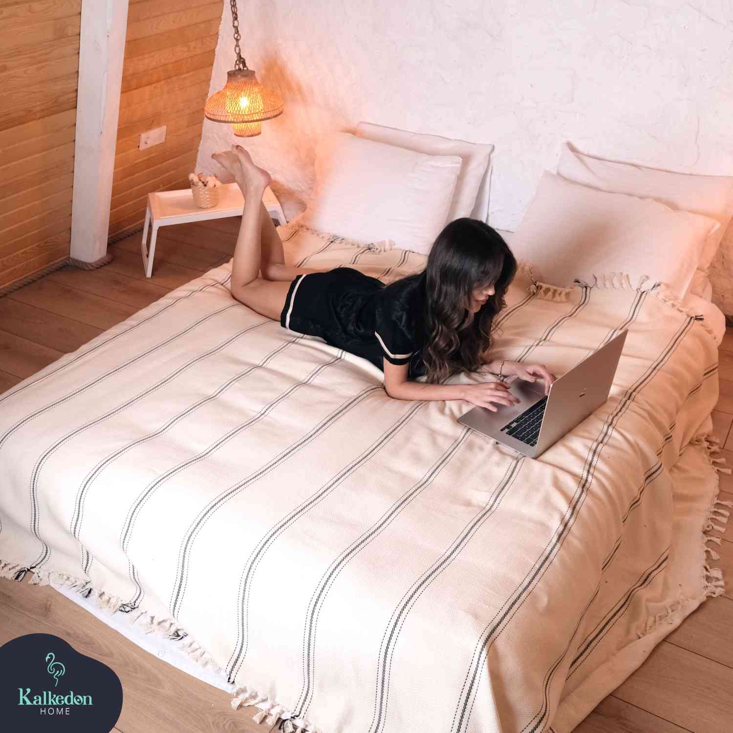 Oversized Turkish muslin cotton throw blanket on a bed